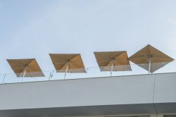 Indus umbrellas in beige canvas in continuity